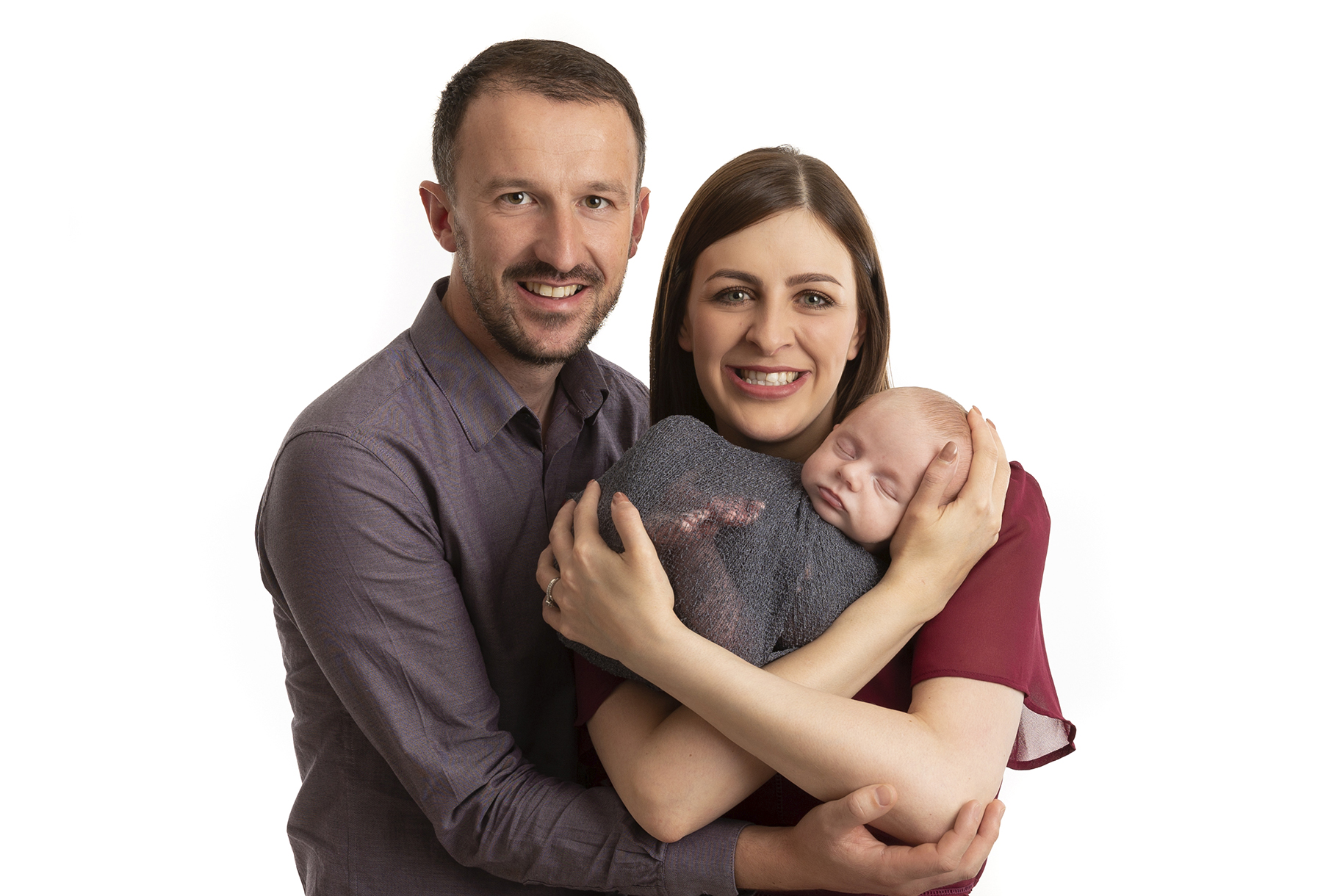 mum, dad and baby boy cuddling by baby photographer Dumfries