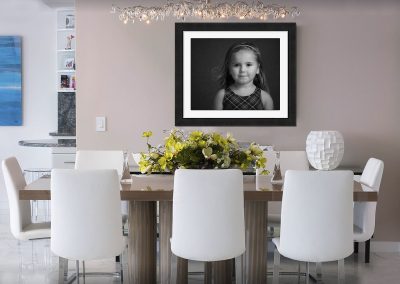 photo of child on wall display by children's photographer Dumfries