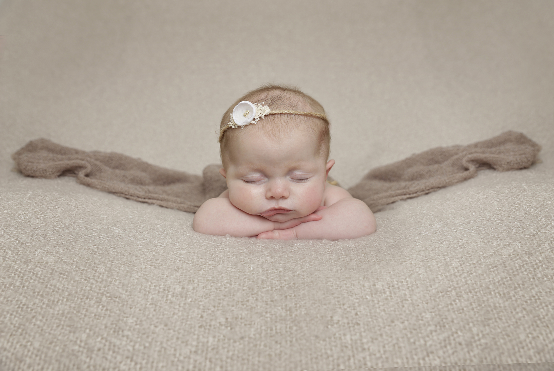 baby girl sleeping with headband by newborn Photographer Dumfries