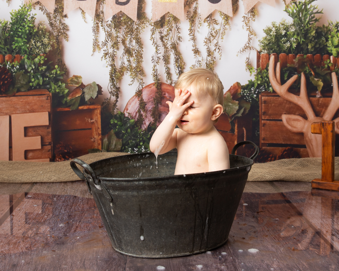 Boy in old tin bath