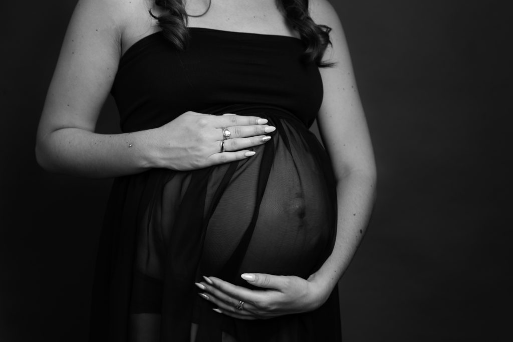 black and white image of pregnant lady bump