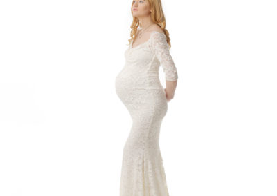 Beautiful lay wearing a maternity gown during a pregnancy photo session